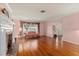 This bright living room has hardwood floors, a fireplace and large window at 1541 Flower Dr, Sarasota, FL 34239