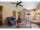 Cozy sun room with tiled floors, comfortable seating, and lots of natural light at 1541 Flower Dr, Sarasota, FL 34239