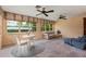 Bright sun room featuring ample windows, tiled floors, and comfortable seating at 1541 Flower Dr, Sarasota, FL 34239