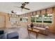 Charming sun room with tile floors, lots of natural light, and neutral decor at 1541 Flower Dr, Sarasota, FL 34239