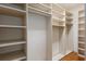 Spacious walk-in closet with ample shelving and hanging space, perfect for organization at 1541 Flower Dr, Sarasota, FL 34239