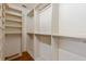 Bright walk-in closet featuring shelving, hanging rods, and plenty of storage space at 1541 Flower Dr, Sarasota, FL 34239