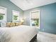 Cozy bedroom with a comfortable bed, neutral decor, and plenty of natural light at 1732 6Th St, Sarasota, FL 34236