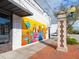 Exterior view of building featuring IMPACT Theatre mural, street view and light post at 1732 6Th St, Sarasota, FL 34236
