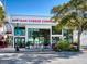 Artisan Cheese Company storefront with large windows, exterior seating, and street view at 1732 6Th St, Sarasota, FL 34236