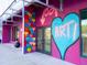 Building exterior featuring colorful heart mural and a pink painted building at 1732 6Th St, Sarasota, FL 34236