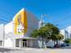 Exterior view of a building with a large mural and trees at 1732 6Th St, Sarasota, FL 34236