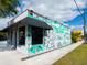 Building exterior featuring 'Dream Large' lettering and a drawing of a palm tree at 1732 6Th St, Sarasota, FL 34236