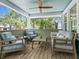 Relaxing front porch with ample seating, providing a cozy outdoor living space at 1732 6Th St, Sarasota, FL 34236