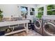 Bright laundry room with stainless steel washer and dryer, a large sink, and a window at 1732 6Th St, Sarasota, FL 34236
