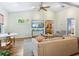 Bright living room featuring an open floorplan, stylish furnishings, and hardwood floors at 1732 6Th St, Sarasota, FL 34236