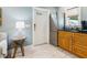 Living room features a wet bar, refrigerator, and white door with windows at 1732 6Th St, Sarasota, FL 34236