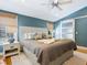 Comfortable bedroom with an ensuite, a ceiling fan, and natural light at 1732 6Th St, Sarasota, FL 34236