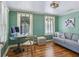Cozy home office featuring natural light, wood floors, and comfortable seating at 1732 6Th St, Sarasota, FL 34236