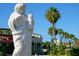 Elegant statue adds character to the neighborhood, complemented by lush greenery and palm trees at 1732 6Th St, Sarasota, FL 34236