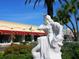 Detailed statue of Poseidon enhances the charm of the surrounding commercial district on a bright, sunny day at 1732 6Th St, Sarasota, FL 34236