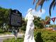 Statue of Allegory of Sarasota's Seven Virtues adds charm to an area with local signage and greenery at 1732 6Th St, Sarasota, FL 34236