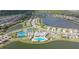 A panoramic aerial shows houses surrounding multiple lakes, a clubhouse, pool, and pickleball courts at 17320 Polo Trl, Bradenton, FL 34211