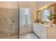 Modern bathroom with glass enclosed shower, double sink vanity, and stylish fixtures at 17320 Polo Trl, Bradenton, FL 34211
