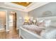 Tranquil bedroom with an arched doorway to the Primary bath, providing a private and convenient retreat at 17320 Polo Trl, Bradenton, FL 34211