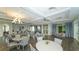 A spacious common room with ample seating, a bar area and plenty of natural light at 17320 Polo Trl, Bradenton, FL 34211