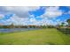 Expansive green space with lake views, perfect for outdoor activities at 17320 Polo Trl, Bradenton, FL 34211