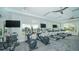 Bright gym with treadmills, ellipticals, and scenic pool views at 17320 Polo Trl, Bradenton, FL 34211
