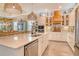Modern kitchen with stainless steel appliances and center island with seating at 17320 Polo Trl, Bradenton, FL 34211