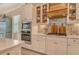 Gourmet kitchen with white cabinets and stainless steel appliances at 17320 Polo Trl, Bradenton, FL 34211