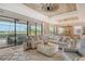 Bright living room with sliding glass doors leading to pool and water views at 17320 Polo Trl, Bradenton, FL 34211