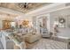 Spacious living room features a ceiling fan and an arched doorway to the entryway at 17320 Polo Trl, Bradenton, FL 34211