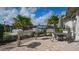 Outdoor grilling area with stainless steel grills and a dining table at 17320 Polo Trl, Bradenton, FL 34211