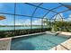 Screened pool and spa overlooking a serene lake, perfect for relaxation and enjoying the beautiful views at 17320 Polo Trl, Bradenton, FL 34211