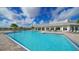 An inviting community pool with lounge chairs for relaxation and enjoyment at 17320 Polo Trl, Bradenton, FL 34211