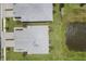 Aerial view of the property showcasing the roof, landscaping, and proximity to the community pond at 17823 Cherished Loop, Bradenton, FL 34211