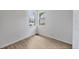 Sunlit room with tile floors, two windows, and a doorway at 17823 Cherished Loop, Bradenton, FL 34211
