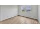 Bright, unfurnished bedroom with dual windows and wood-look tile flooring at 17823 Cherished Loop, Bradenton, FL 34211