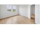 Unfurnished bedroom with wood-look tile flooring and scenic views from the double windows at 17823 Cherished Loop, Bradenton, FL 34211