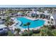Community pool featuring modern design and palm trees, ideal for relaxation and recreation at 17823 Cherished Loop, Bradenton, FL 34211