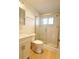 Updated bathroom with glass shower door, subway tile, new vanity, and vinyl flooring at 1880 Sunny Dr # F35, Bradenton, FL 34207