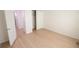 Vacant bedroom showing vinyl flooring, closet, and doors at 1880 Sunny Dr # F35, Bradenton, FL 34207