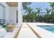 Inviting backyard patio with lush landscaping and a sparkling pool, perfect for outdoor entertaining at 2124 Clematis Pl, Sarasota, FL 34239