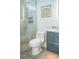 Bathroom features a modern toilet and shower with marble-style tiles and decor at 2124 Clematis Pl, Sarasota, FL 34239