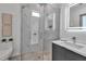 Modern bathroom features a glass shower with marble tile, contemporary vanity, and neutral tiling at 2124 Clematis Pl, Sarasota, FL 34239
