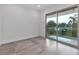 A well-lit bedroom featuring a sliding glass door to the balcony at 2124 Clematis Pl, Sarasota, FL 34239