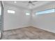 Bright bedroom featuring neutral walls, tile flooring, and recessed lighting at 2124 Clematis Pl, Sarasota, FL 34239