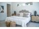 Bright bedroom featuring decorative pillows, stylish lamps, side tables, and a plush rug at 2124 Clematis Pl, Sarasota, FL 34239