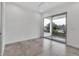 Bright bedroom with a large sliding glass door leading to a balcony at 2124 Clematis Pl, Sarasota, FL 34239