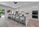 Sleek kitchen with a marble-topped island, white cabinets, and modern pendant lighting at 2124 Clematis Pl, Sarasota, FL 34239