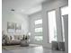 Bright living room with comfortable seating, contemporary art, and ample natural light at 2124 Clematis Pl, Sarasota, FL 34239
